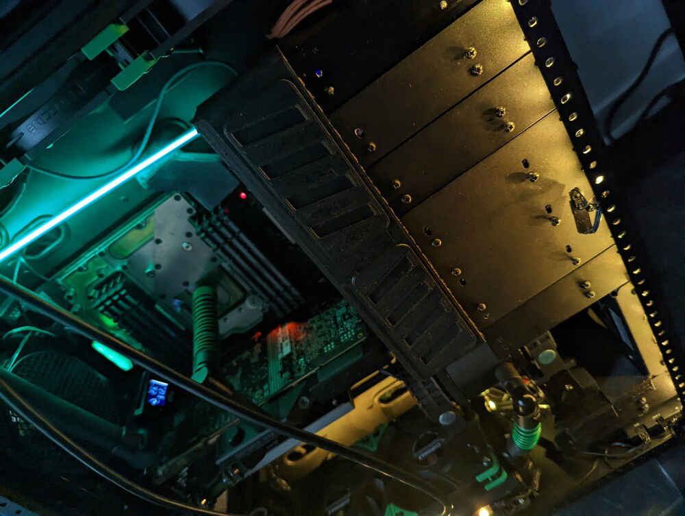 Cover for SATA enclosures. Hides SATA data+power cables, and provides a place to write the serial numbers (useful so you needn't pull N drives to find a particular one). Atomic Filament carbon fiber PETG PRO.