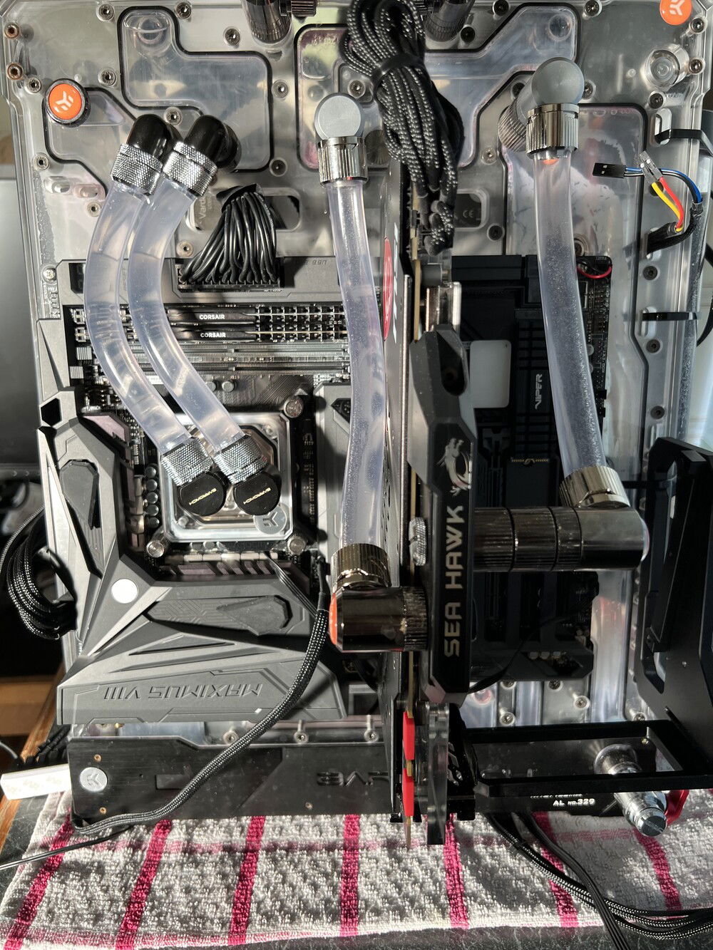 bought this "thing" on a whim and been regretting it ever since f....r is fighting me all the way , was hoping to side mount guess what, no, trying to fit a D5 instead of that meek little 3.2 ,no, had to zip tie a res / pump combo to the side, now just waiting for PCI express riser, to top it all of, mobo just died
