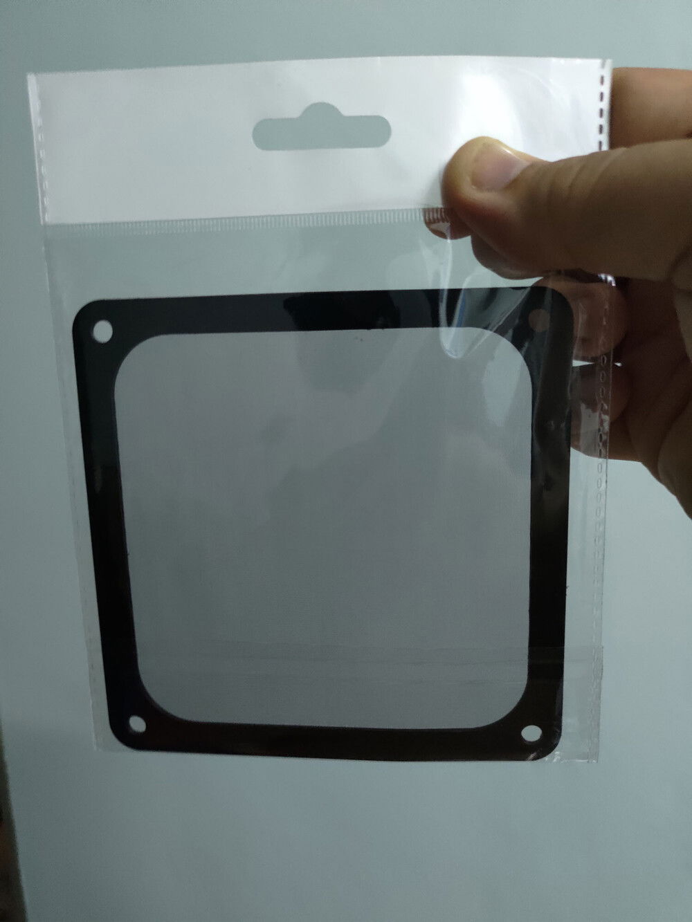 Air filter. Apparently these only comes in black. I will wedge it between the case wall and the fan to minimize visibility.