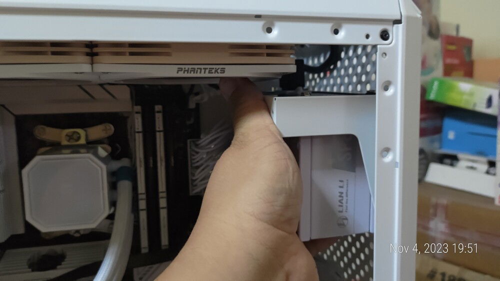 Preparing to finalize mounting the PSU.