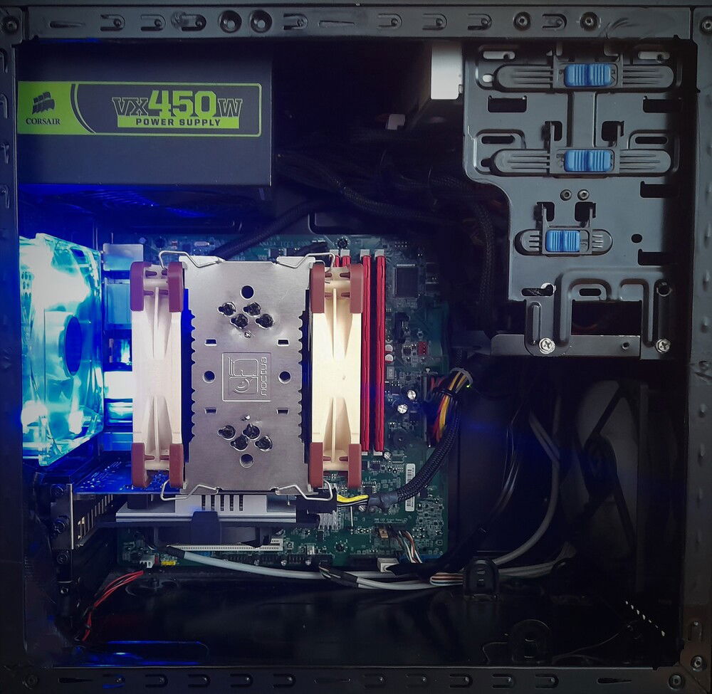 This picture is not recent so the Motherboard is diffrent from the partslist.
(same generation) - sandy/ivy-bridge.