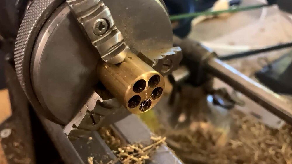 All holes drilled. Pipes are soldered to this housing