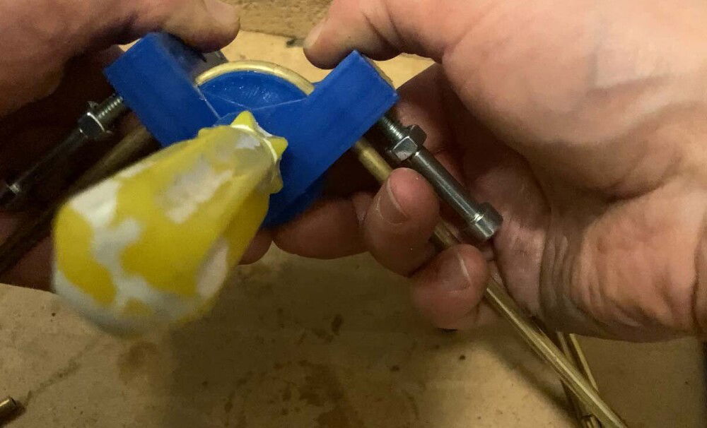 Bending tool in use. Die/roller can be changed to smaller radius. Pipes are bent to 3 different radiuses so they line up nicely when put together