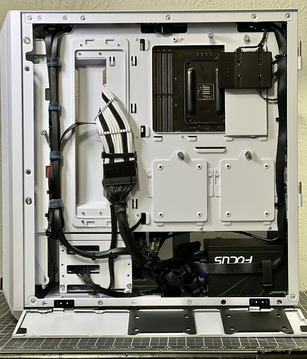 Obligatory cable management shot. Lian Li makes it too easy with their panels that cover the rear.