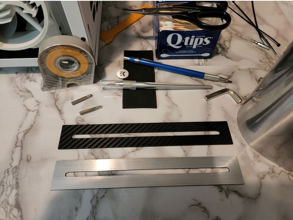 My own improvised dual reservoir mount being crafted out of Alphacool rulers.