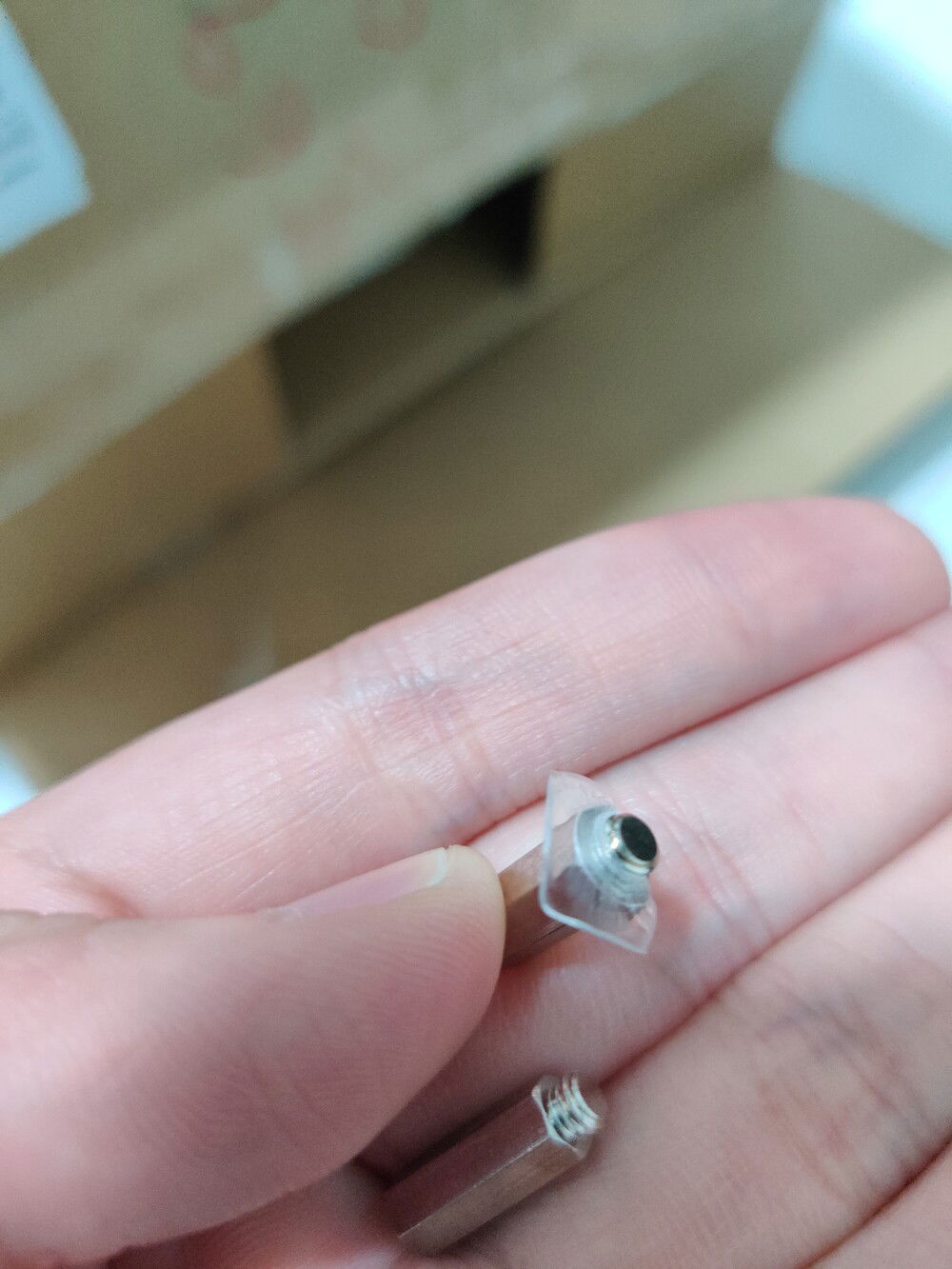 The screws from the left and right corners of the block, one even had a piece of acrylic still attached to it.