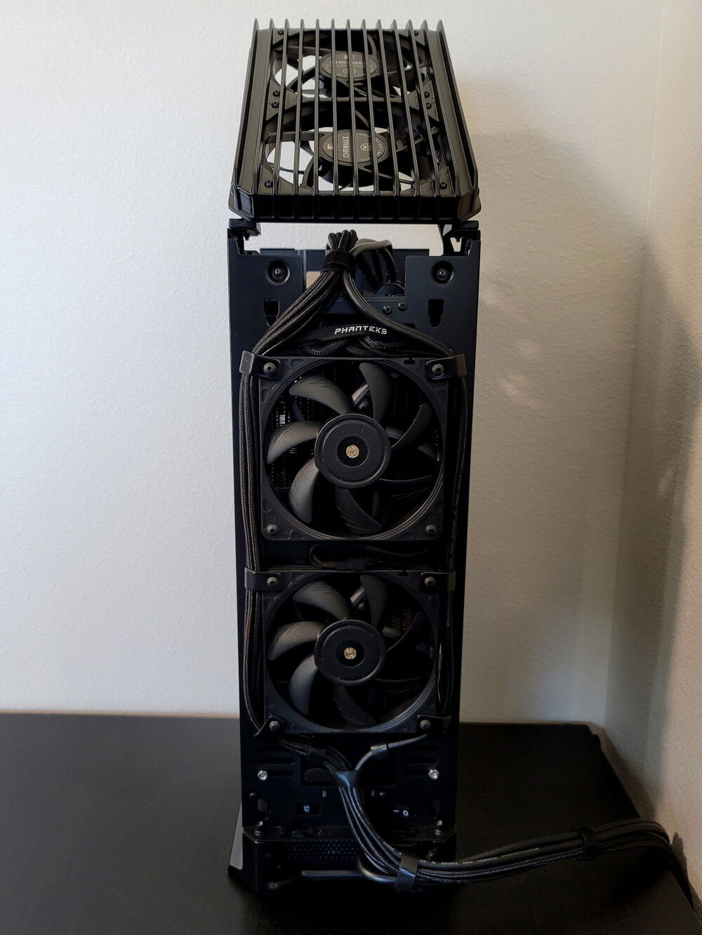 Back side with panels removed. IO cables routed around the fans with 3D printed clips, velcro tie downs built in to the lower part of the rear radiator shroud.