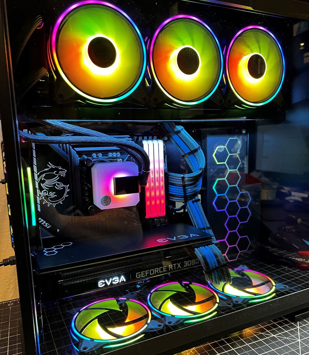 The right side of the inner case was boring, so I added an acrylic panel with RGB lighting. All the various hardware's lighting really blended together well.