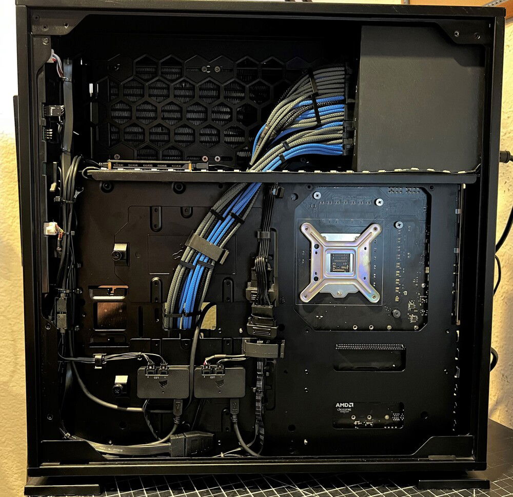 Cable management was really different in this case due to its particular layout. There's an RGB hub in the top tray to the left, and two Corsair Lighting Node Pros down bottom that control all the lighting.