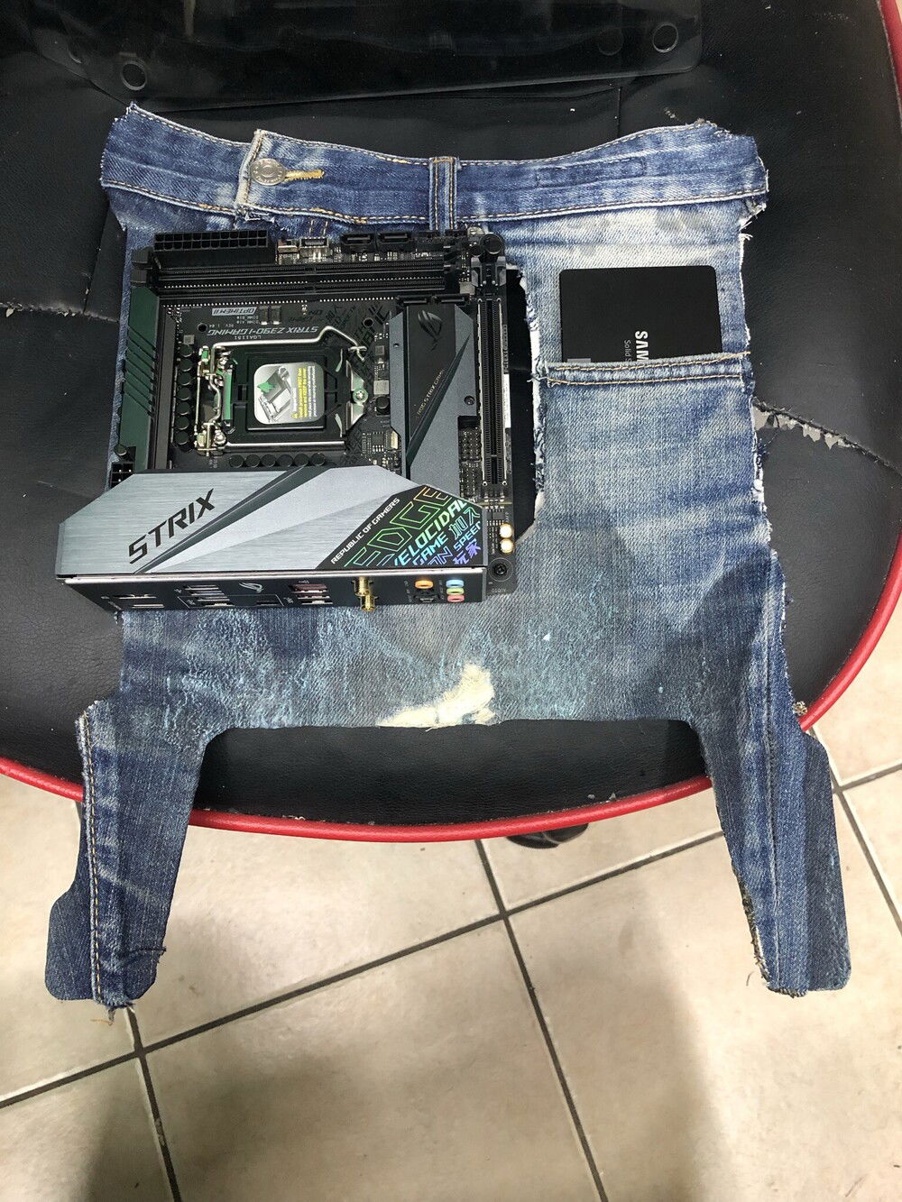An Asus ROG Strix Z390 is used to test the denim parts that will be sewn with the suede back to cover Antec Striker's panel.