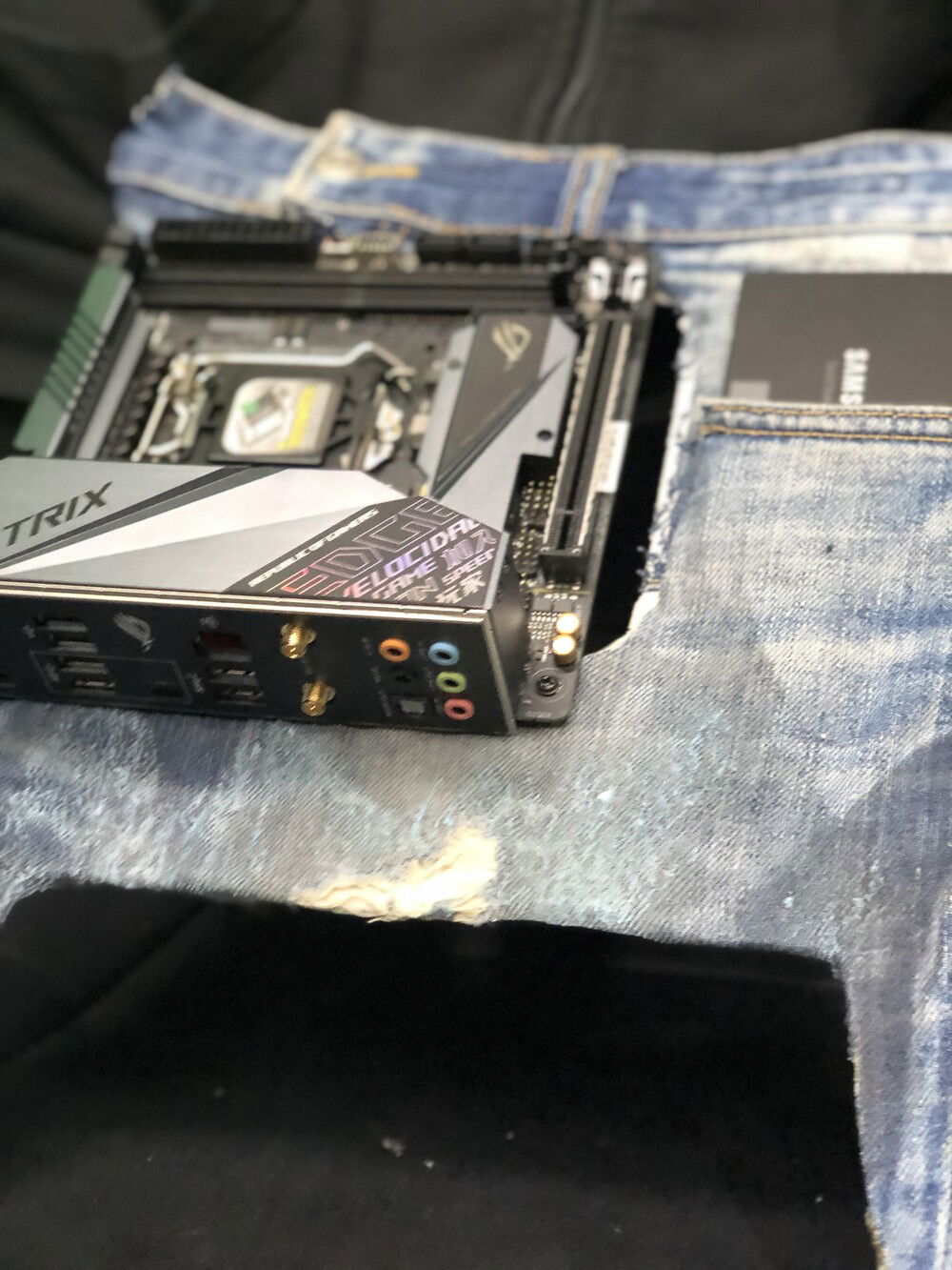 An Asus ROG Strix Z390 is used to test the denim parts that will be sewn with the suede back to cover Antec Striker's panel.