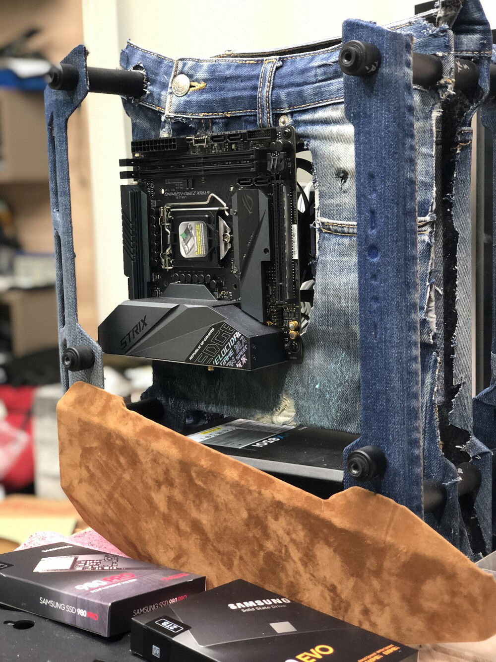 Just before sewing the front-faced denim with the back suede cover of the panels to verify it is correctly cut to size. Also, the bottom covers of the PSU already covered in cognac colored suede leather. (tip: I/O wholes of the panel are not drilled yet)