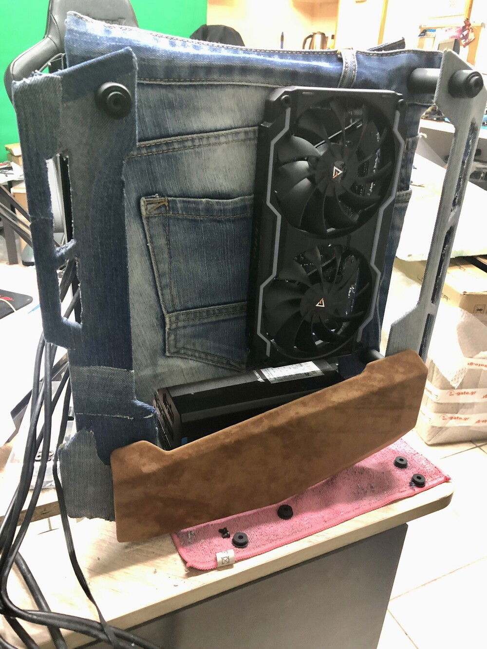 Just before sewing the front-faced denim with the back suede cover of the panels to verify it is correctly cut to size. Also, the bottom covers of the PSU already covered in cognac colored suede leather. (tip: I/O wholes of the panel are not drilled yet).