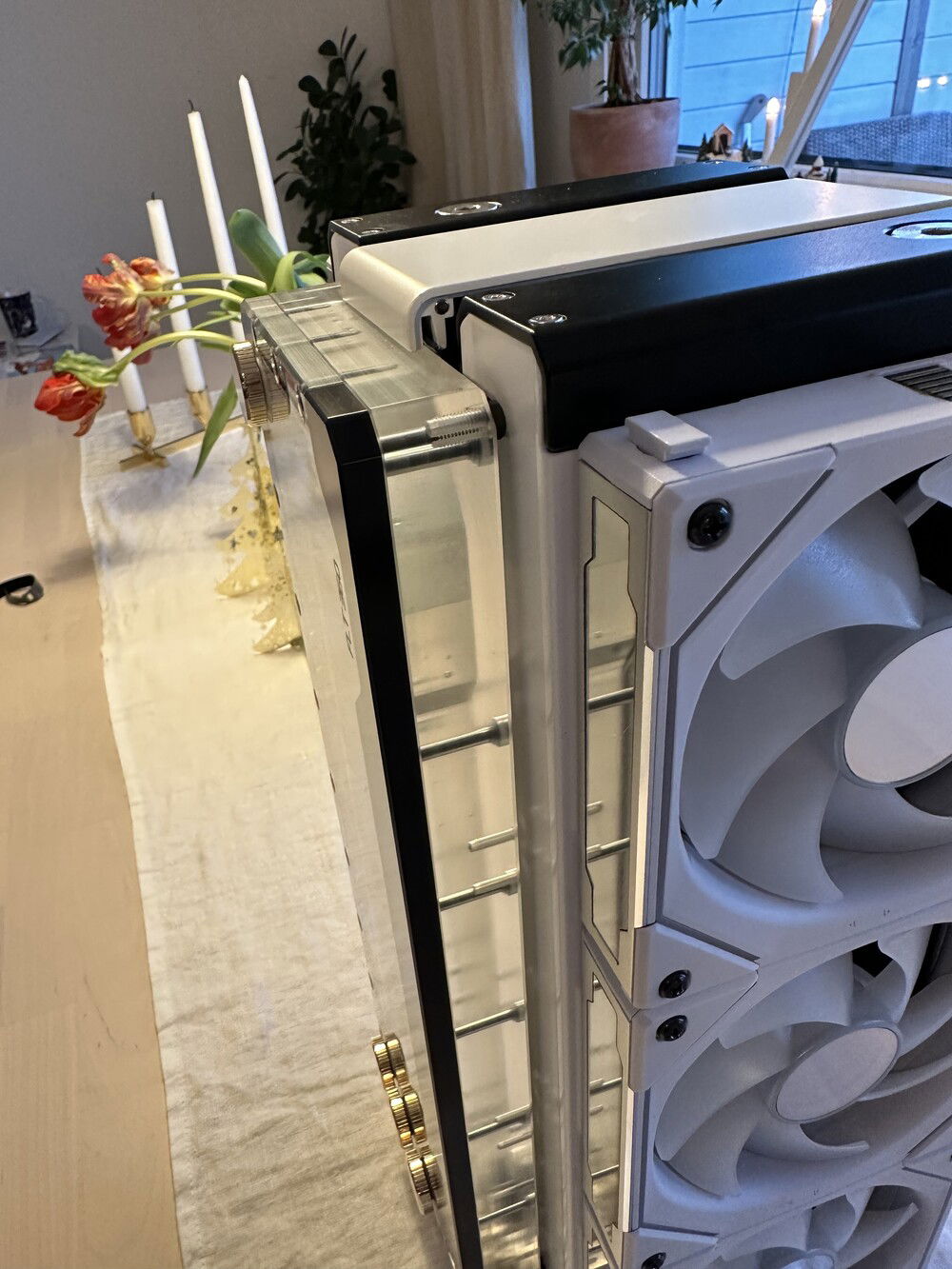 Mounted with screws through side of radiators. Topplate from louqe large tophatt.