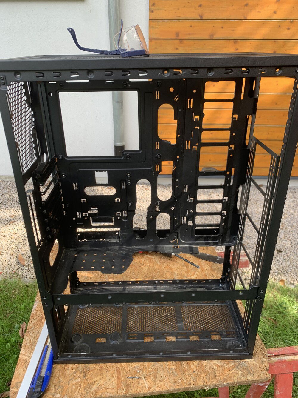 Now some pictures of the building process.
At first, I cut out some parts of the case to make room.