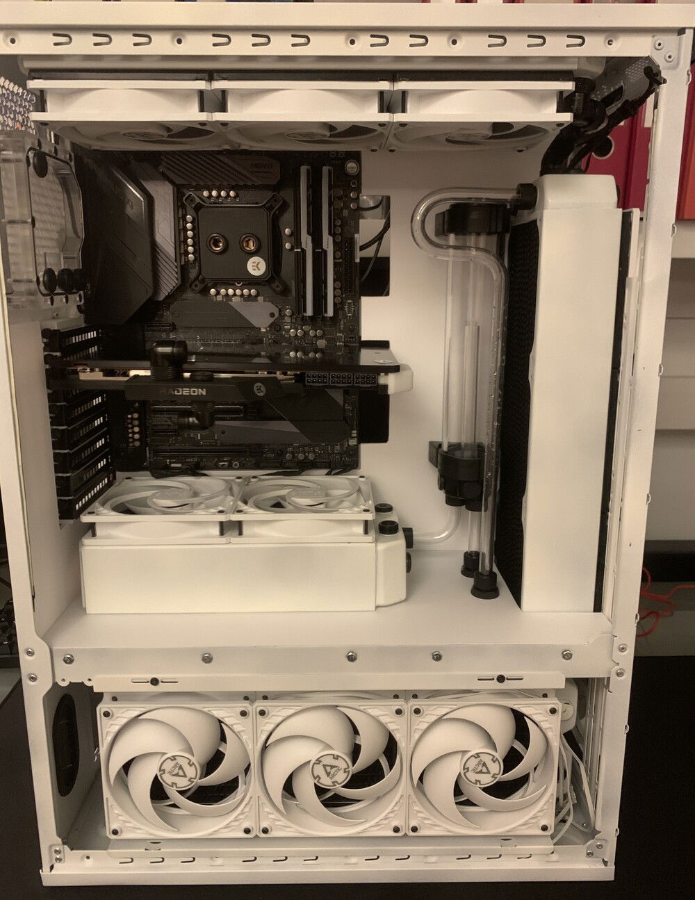 Plugging in the lower connectors on the motherboard wasn't easy with the fans installed on the radiator but it worked.