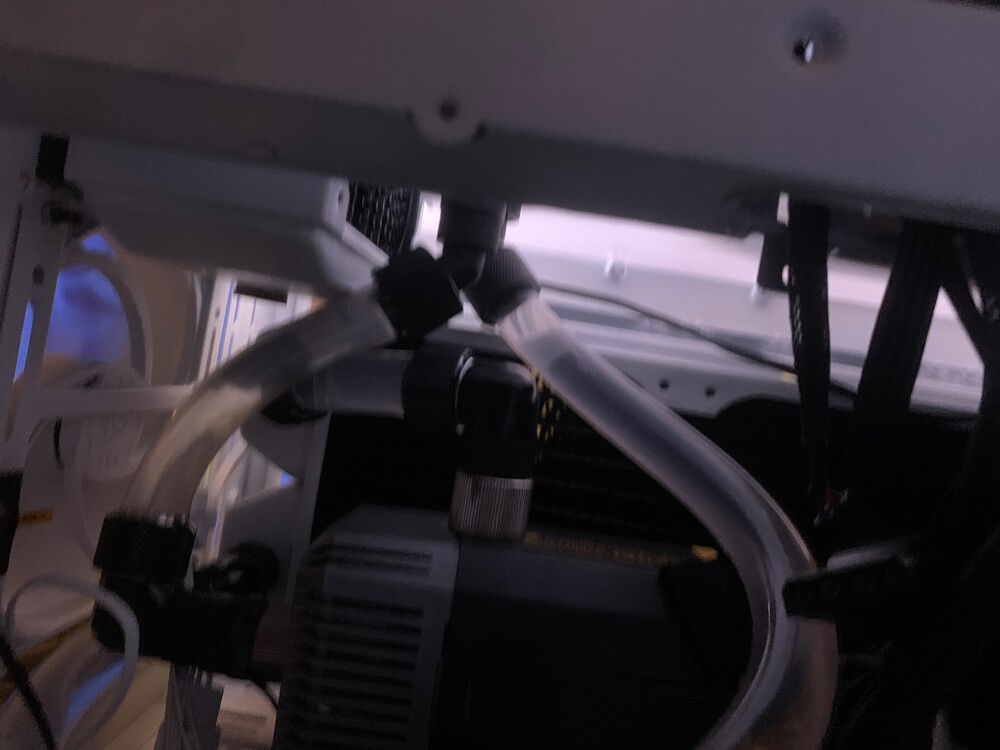 I used soft tubes in the chamber to connect the pump and radiators.