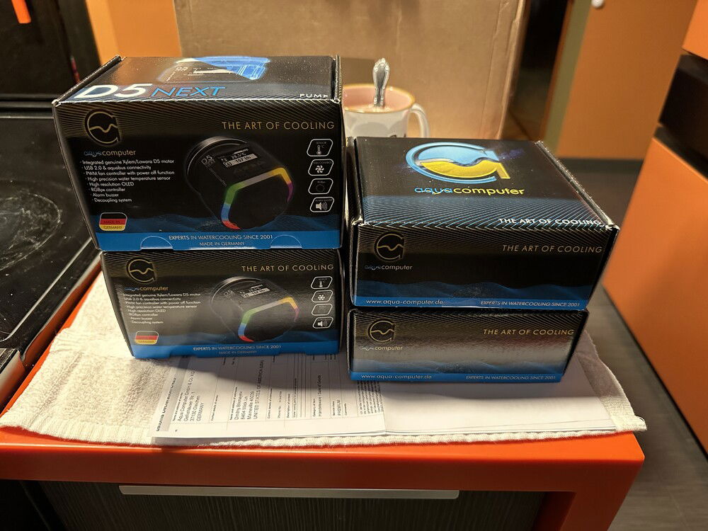 The Aquacomputer components (2 x Leakshield, 2 x D5 Next RGB) have finally arrived after being stuck at USPS Chicago International sorting center for like a week.