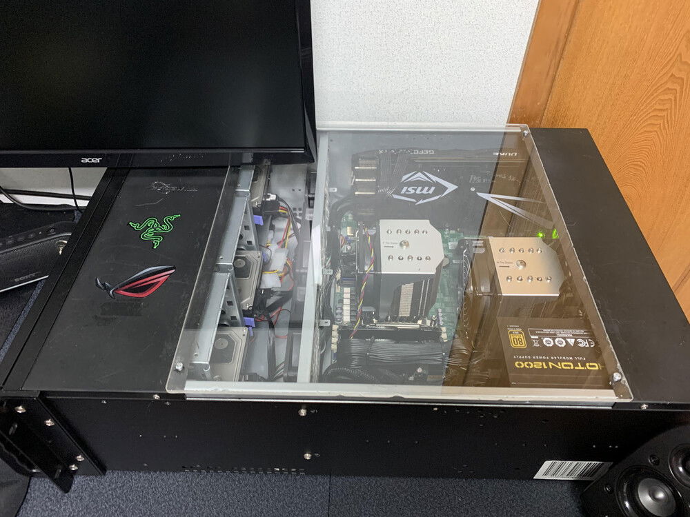 For no reason other than my own enjoyment, I cut out a section of the chassis top and replaced it with plexiglass. I find it fun to see a motherboard with two CPUs in it.