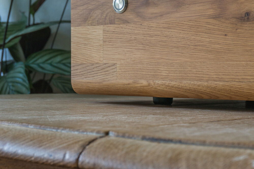 When placed on a desk, the case can be fitted with small rubber feet, raising it just a single centimeter over the surface.