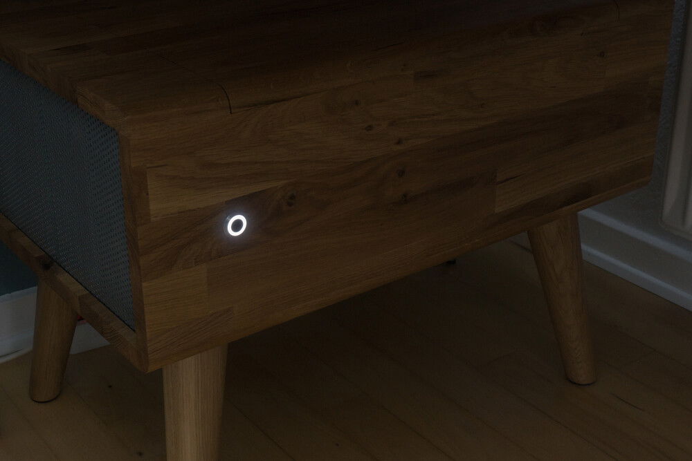 When placed on the floor, the case can be fitted with wooden legs turning it into an actual piece of furniture. The on/off button lights up with a steady white light, when the computer is on. The build intentionally features no other lights or RGB.
