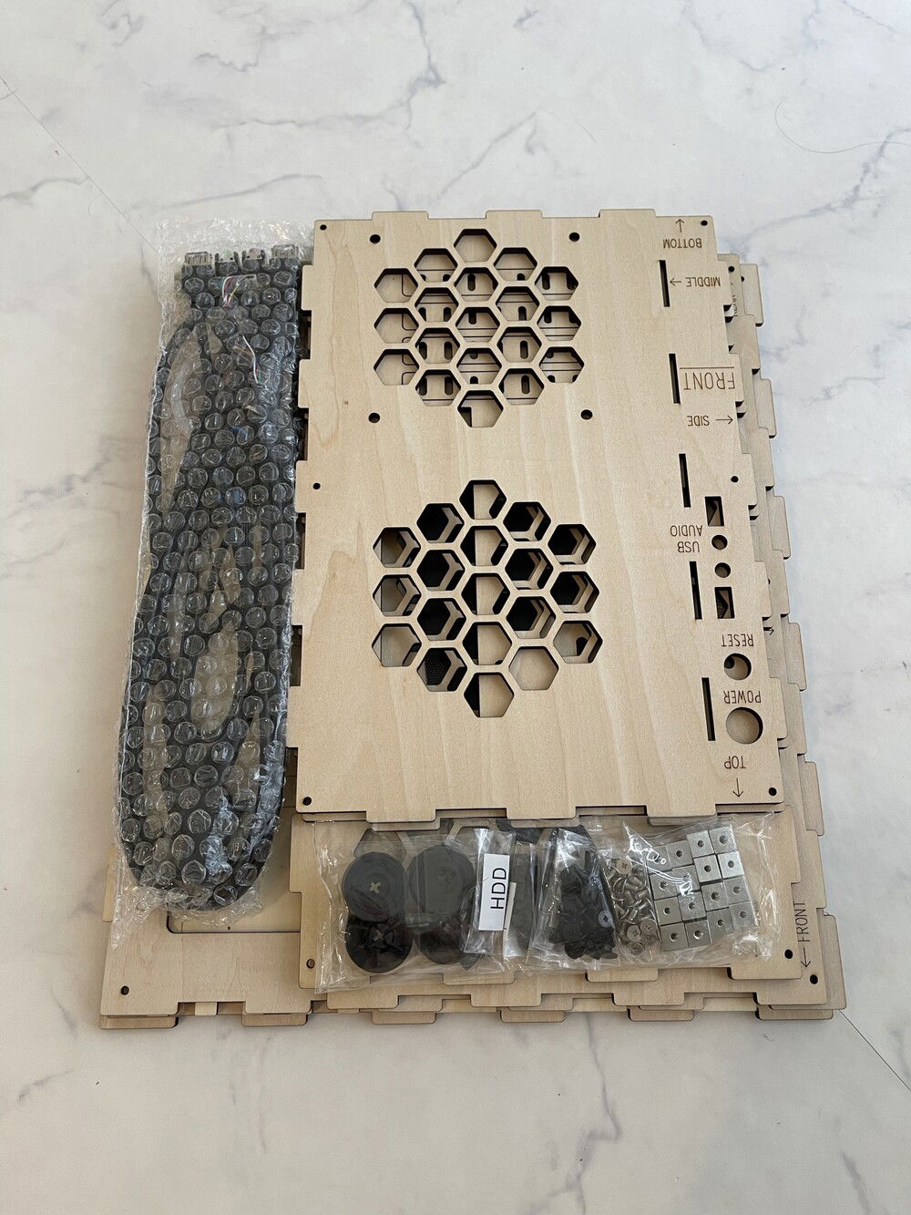 The laser-cut wood was a little too lightly colored for my taste, so I decided to stain everything except the motherboard mount in order to match the Noctua aesthetic.