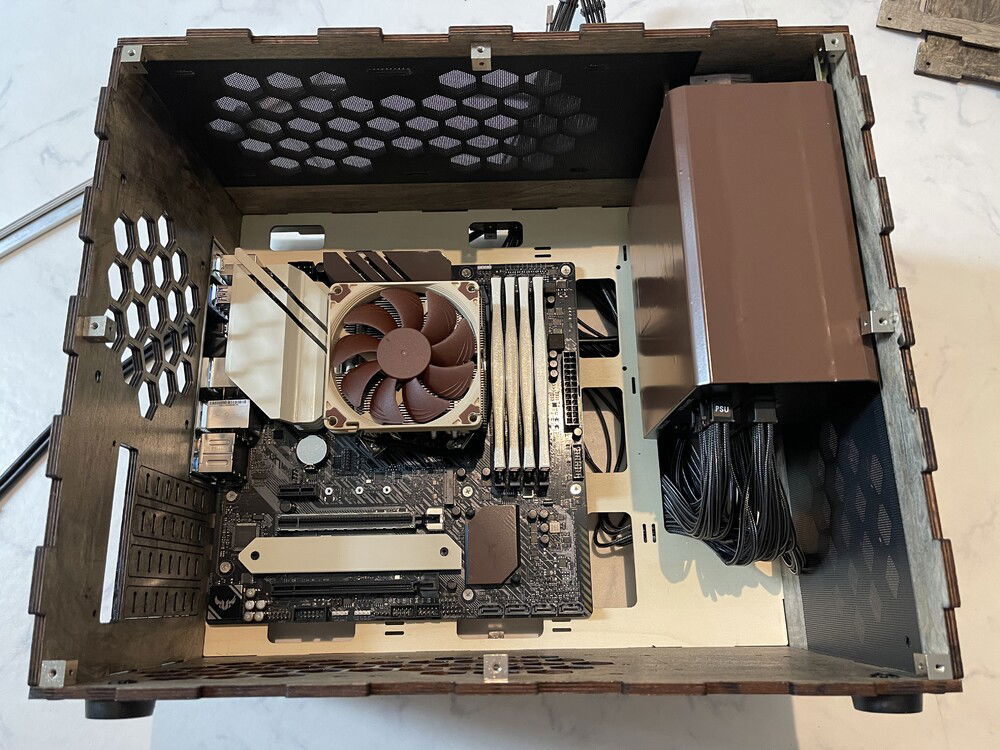 All the internal comonents (RAM, VRM Heat Sinks, NVMe Cover, PSU were painted or wrapped to match the Noctua brown/ beige color scheme.