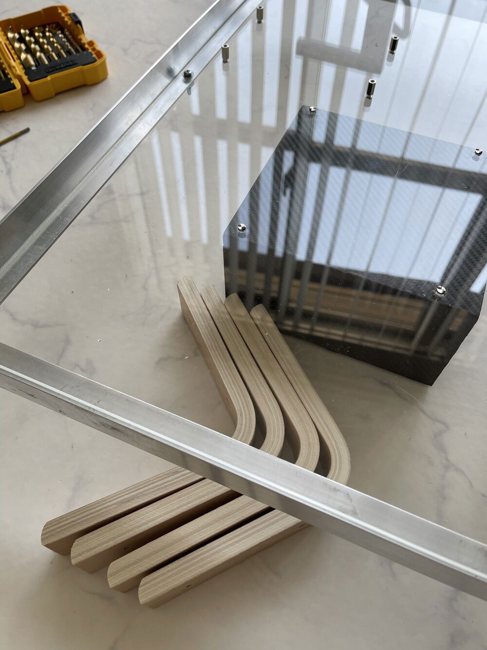 After wrapping the 1000w psu and mounting it to the bottom, I got ready to attach the wooden legs.