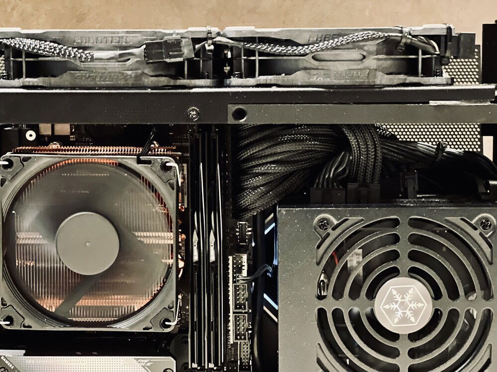 The stock 24-pin cable is about 12"/300mm. Only needed to be about 4-5", so I cleared about 8" of excess cable here.