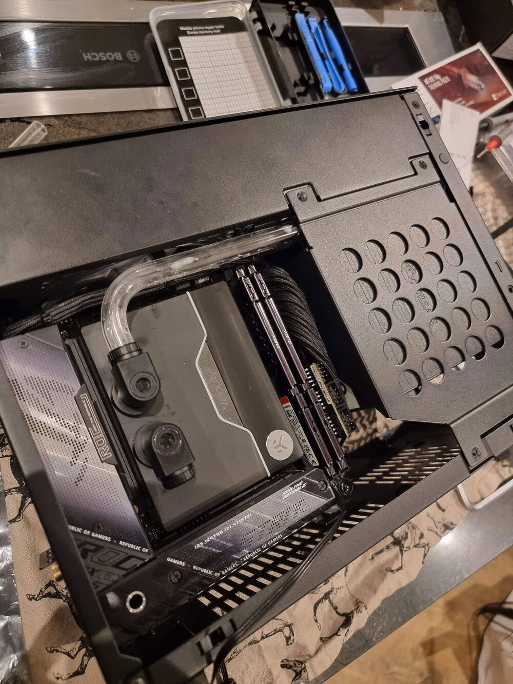 First tubing run done. Behind the PSU bracket the tube also has to curve to go around the IEC inlet port of the PSU.