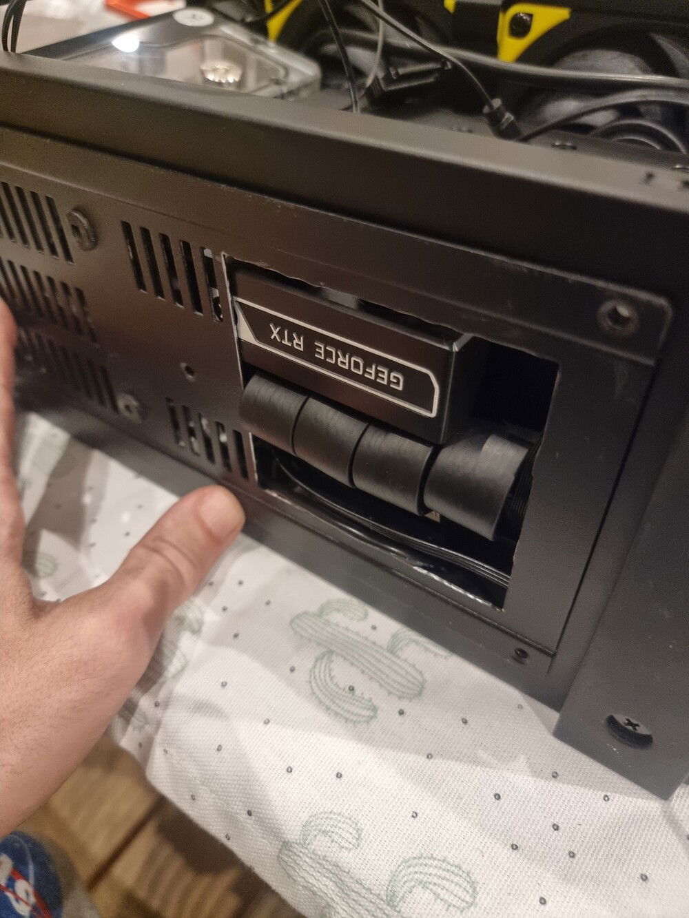 Modification for the PCIe riser cable. It doesn't fit around the case/waterblock and trying to put the bottom cover on pushes it out the PCIe slot, so I removed a section of panel.