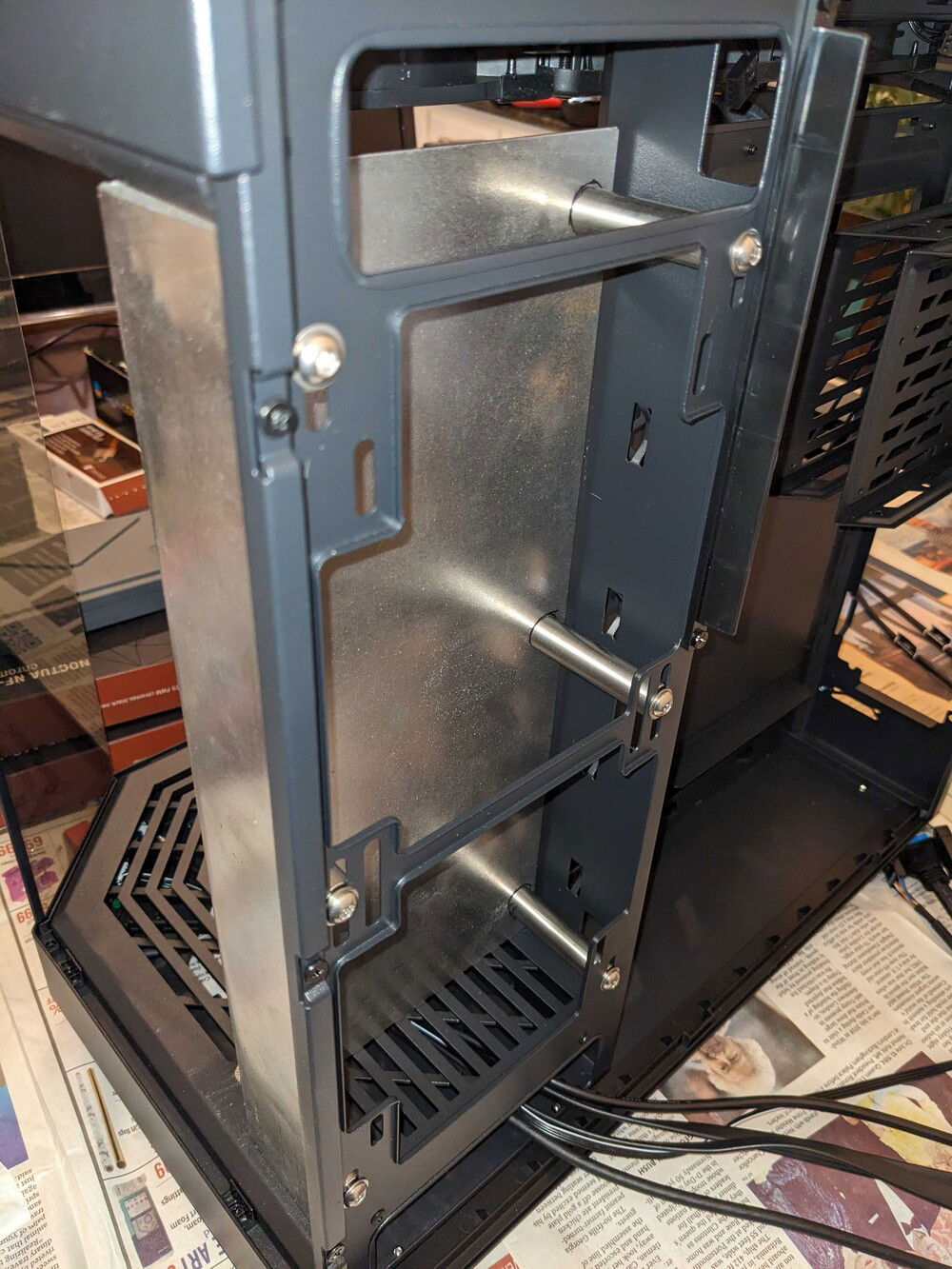 Rear space behind the plate for pipe-routing.  2 inch clearance provided by those stainless stand-offs.