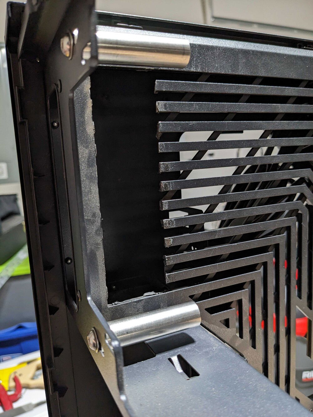 Removed section of the case floor to allow pipes to pass into basement from behind the plate.