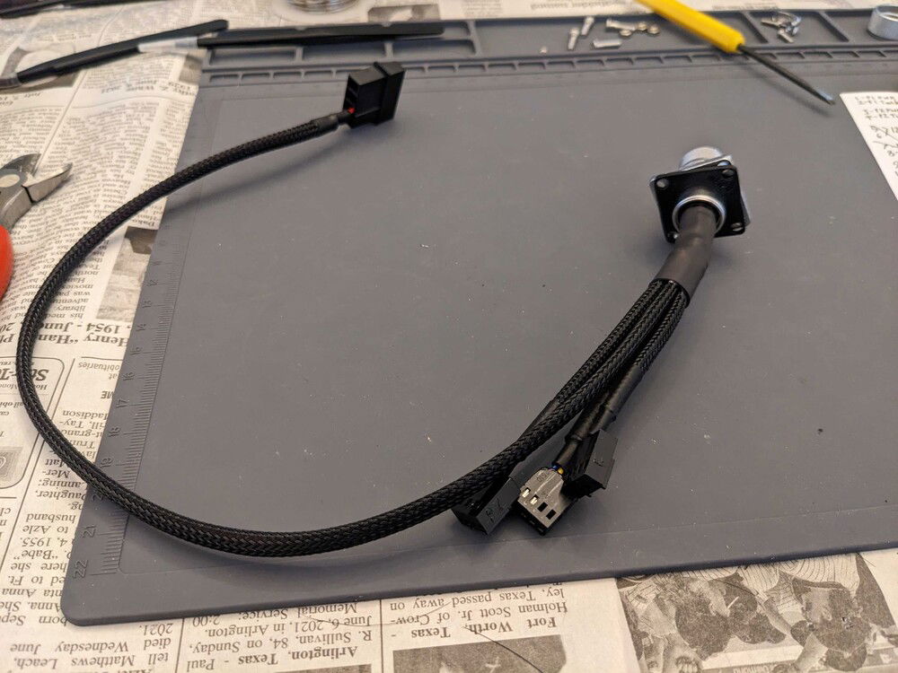 Case-side of the umbilical.  This panel mount aviation-connector mounts on in the hole drilled in the side of the case.