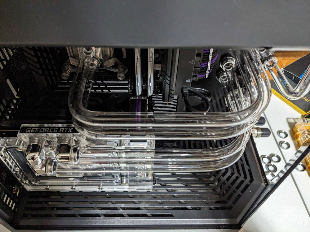 Top view of the pipes bends.  I went with a tighter bend radius on the CPU turn to get more straight pipe parallel with the GPU runs.  I think it looks better that way.  That bottom pipe for the top rad I was talking about looks kinked here, but it's just the angle and lighting.
