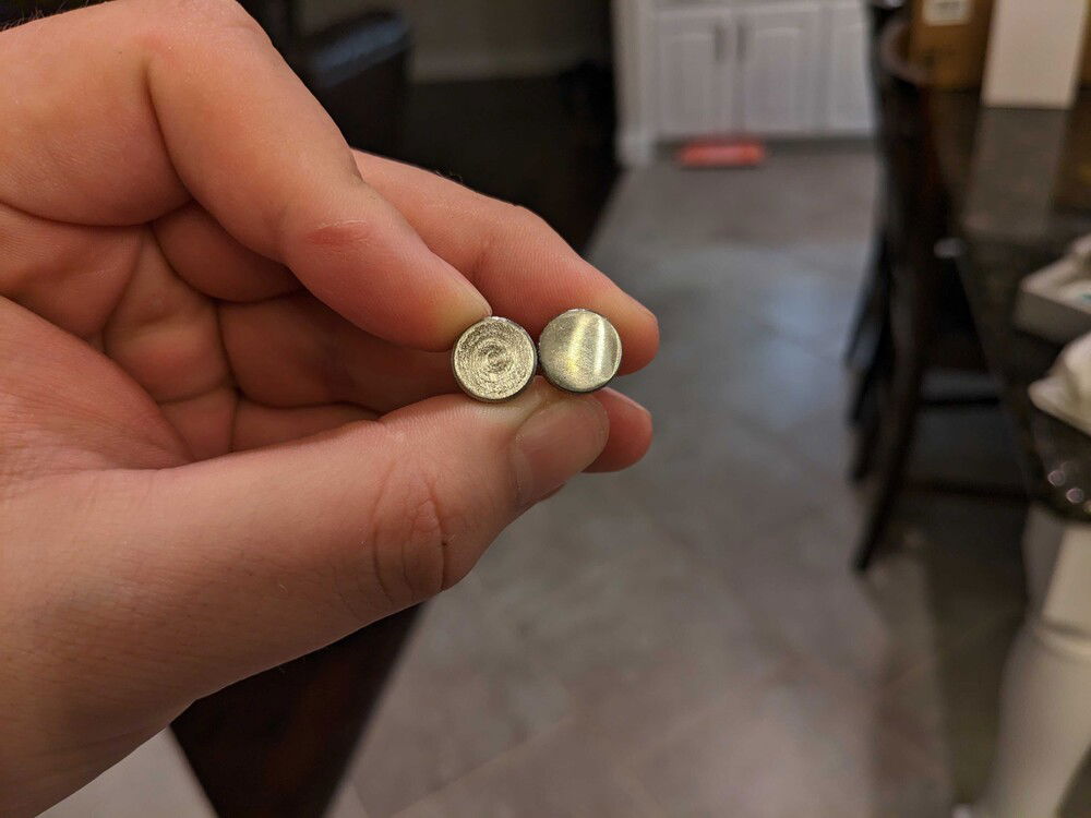 I don't have the skills or gear to get them perfectly flat, but they look much better.  Left is factory, right is sanded and badly-polished.