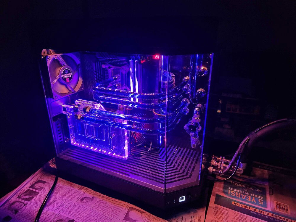 RGB on.  I'm going for something with some character without being flashy nonsense.  The lighting is static.  There is a dim red shining up from behind the GPU and a golden orange shining downward from top lights.  It kind of gives a stage-lighting effect that really makes the purple tubes stand out nicely.