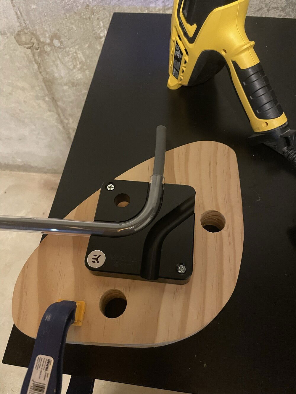 Jig setup for the first real bend. I used the EK Modulus for the bends, but also have tried the ThermalTake kit. I liked that the EK tool holds the tube in place, whereas the ThermalTake tools you have to hold the bend perfectly still until it's cool. I ended up using the mandrel, tube cutter, and end reamer for the TT kit anyway.