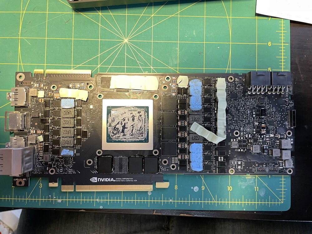 Stock cooler removed, and starting the painful task of removing the old thermal pads and paste.