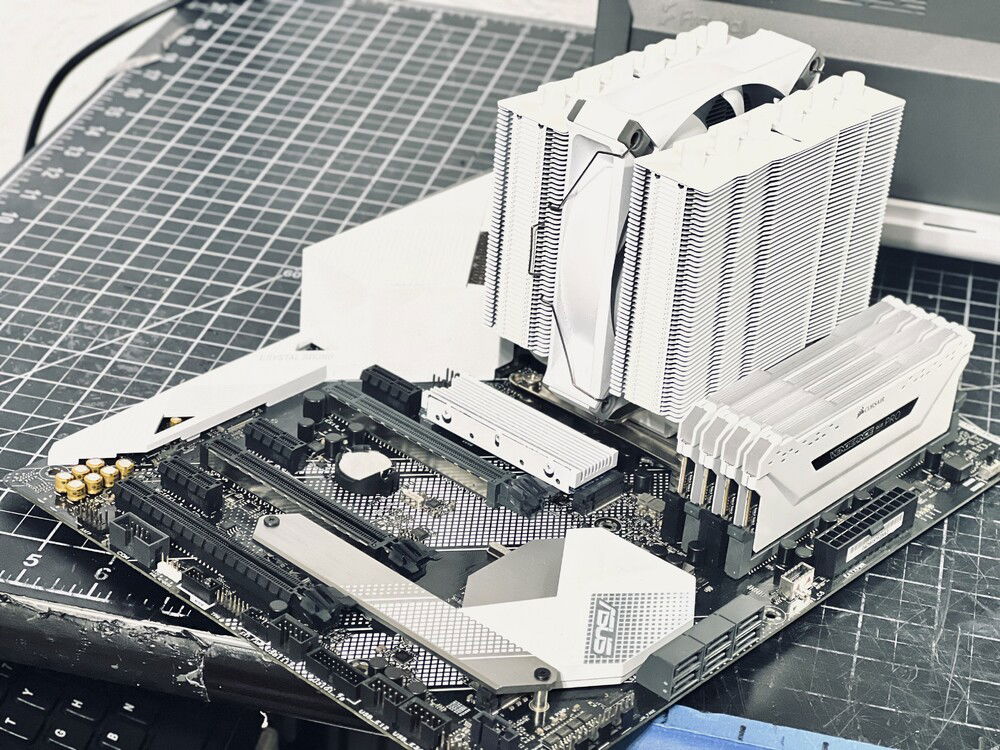 White on white looks so clean. I swapped the CPU cooler's fan for a Corsair AF120.