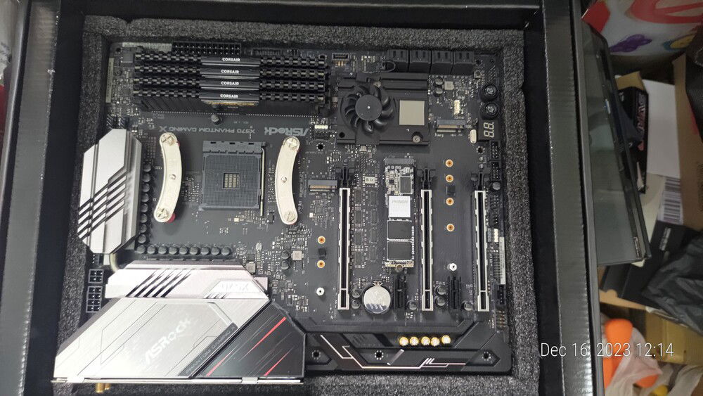 I accidentally got sweat onto the Mobo! Time to pull off the heatsink and let it dry.