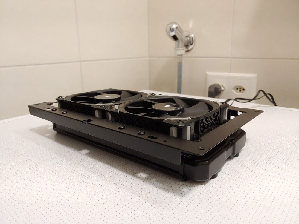 As per design, there is no place for a radiator on the top. I installed it by trimming the case top bracket and adding a 3dr party bracket to it.