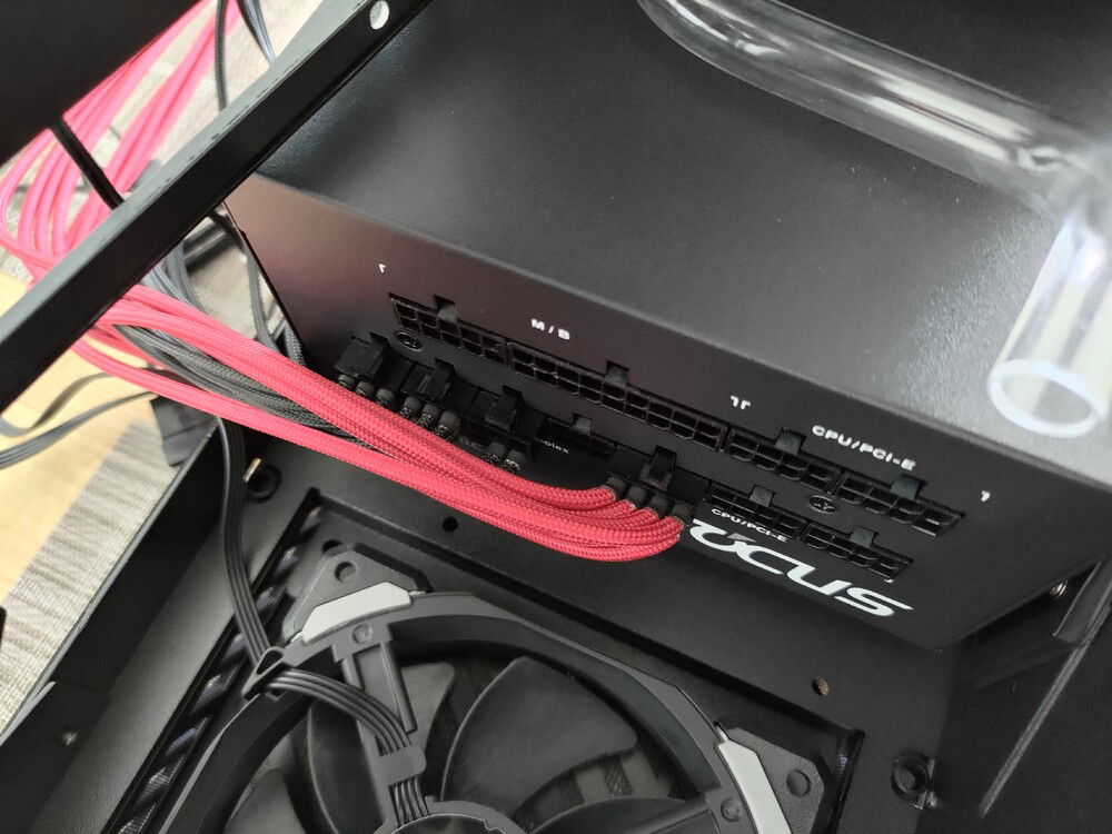 PSU cables did not fit because of the fat red radiator, I had to trim the plastic connectors.