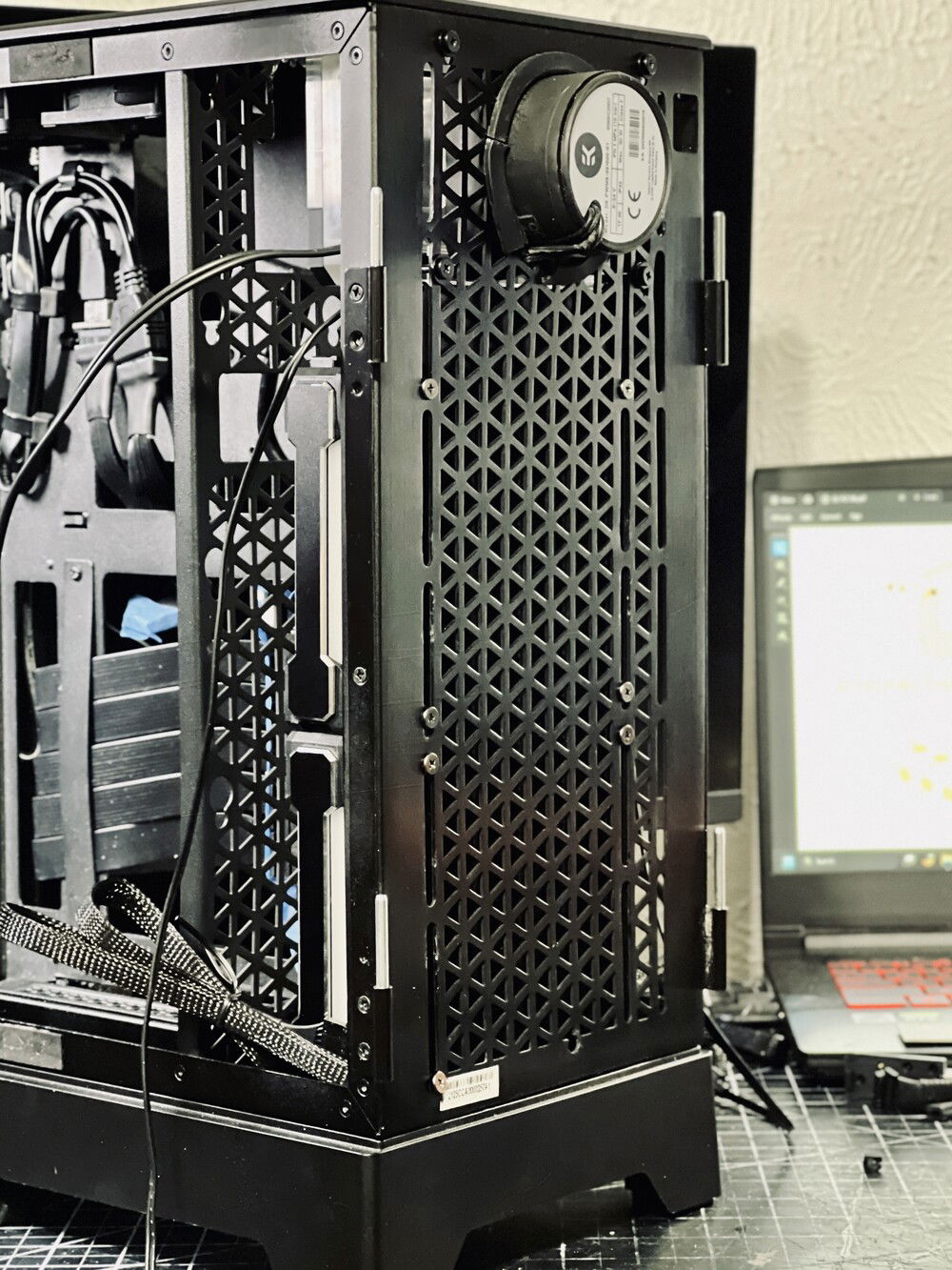 I used a Dremel to allow for the D5 pump in the rear. Also had to remove some of the floor to allow the radiator to shift downwards.