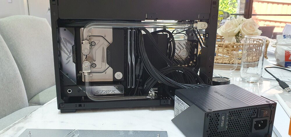 Fittings on radiator: Rad -> 14mm rotary offset -> micro 90 adapter -> micro 90 adapter.  Comes close to the edge of the case to line up nicely with CPU block fittings.