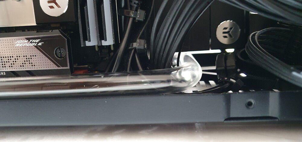 CPU side: Goes under GPU on the outside of power connector.