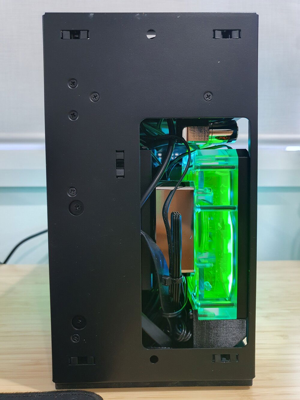 Most of my excess cables are stuffed under the PSU and also up in the radiator compartment where there is some room. Here you can also see the double micro 90 adapters which plug into a 14mm offset above.