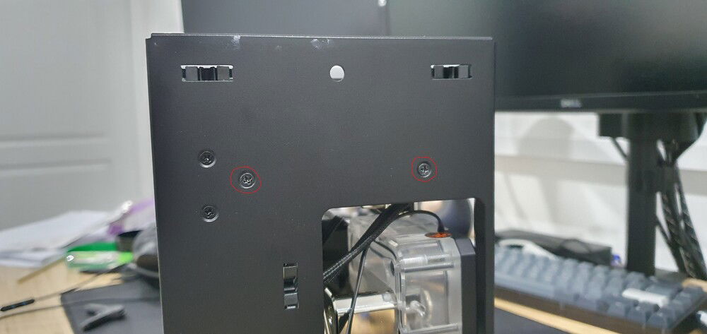 Remove circled screws to help get radiator in.