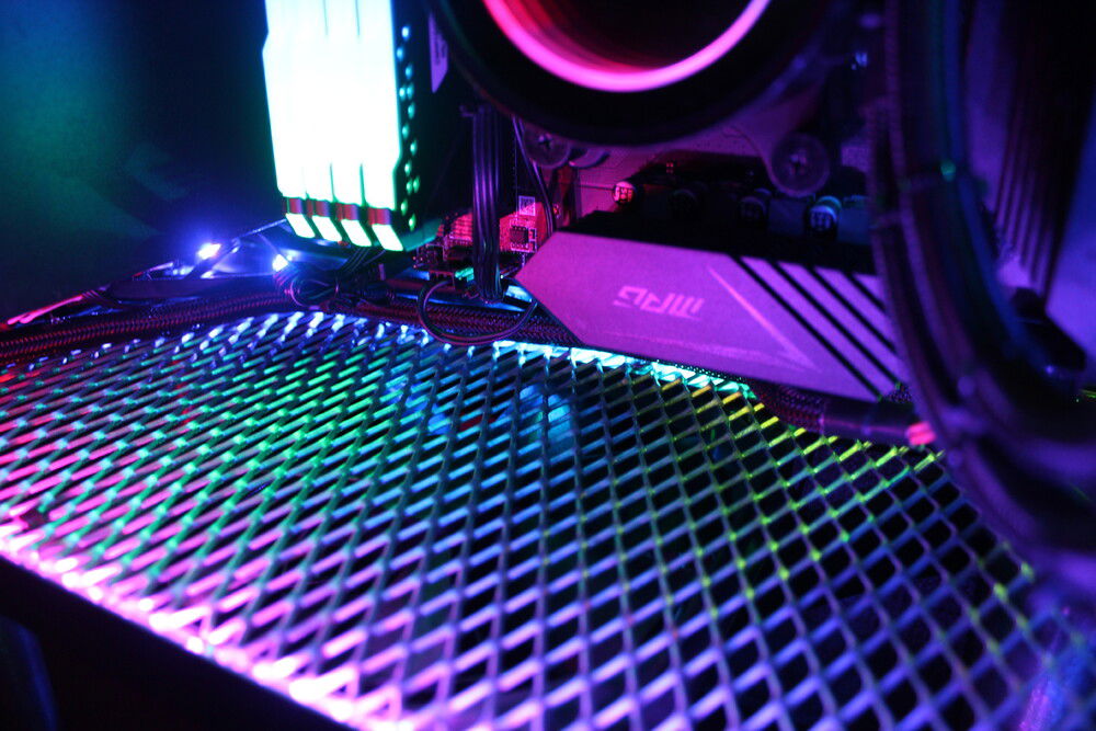The bottom grill allows air to freely escape out of the bottom of the case while beautifully reflecting the RGB lighting. An additional slim 140mm fan is mounted under the case for extra exhaust power when needed.