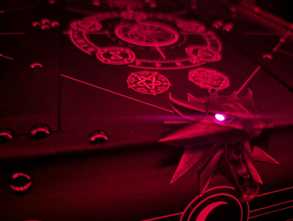 Witcher Amulet; glowing eyes act as the power led